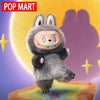 A gray Labubu Big Into Energy plush doll with large ears and a playful expression.