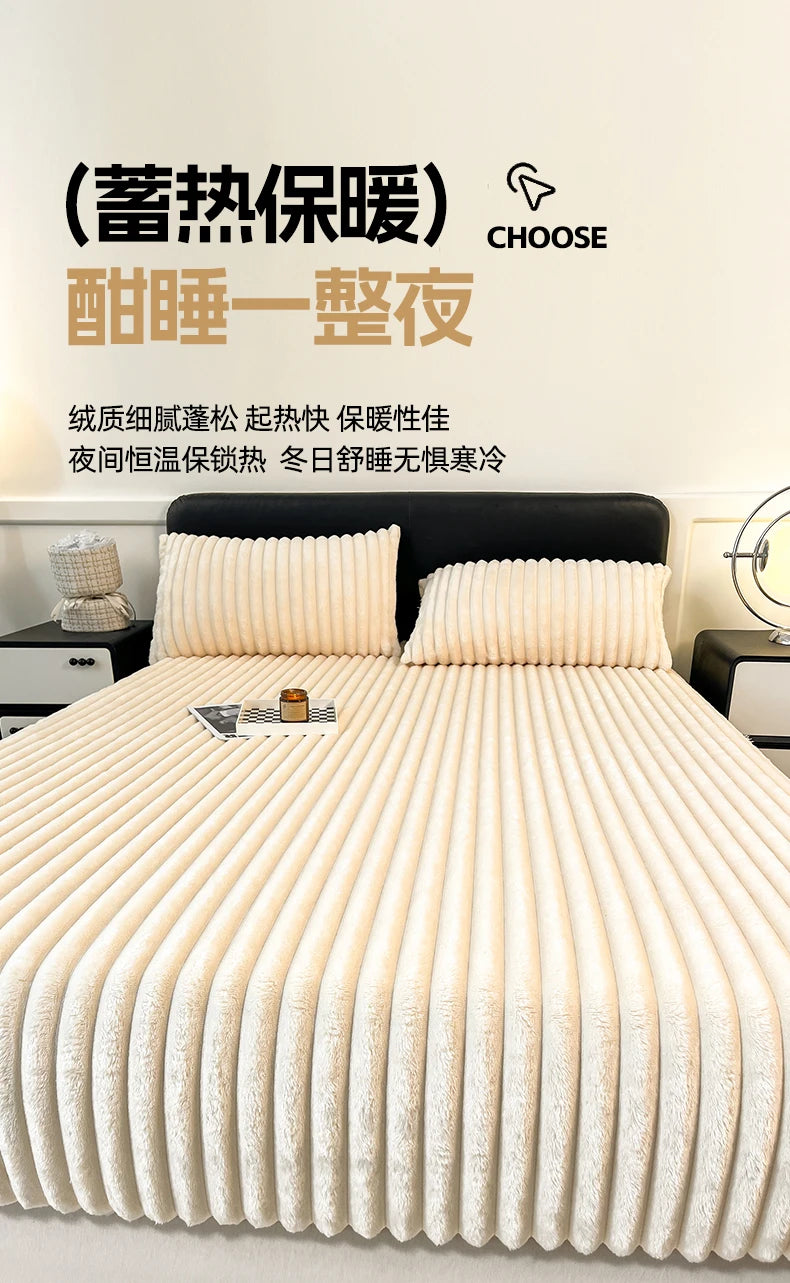 A close-up of a thick, ribbed, cream-colored knit fitted bed sheet with two fluffy pillows on a bed.
