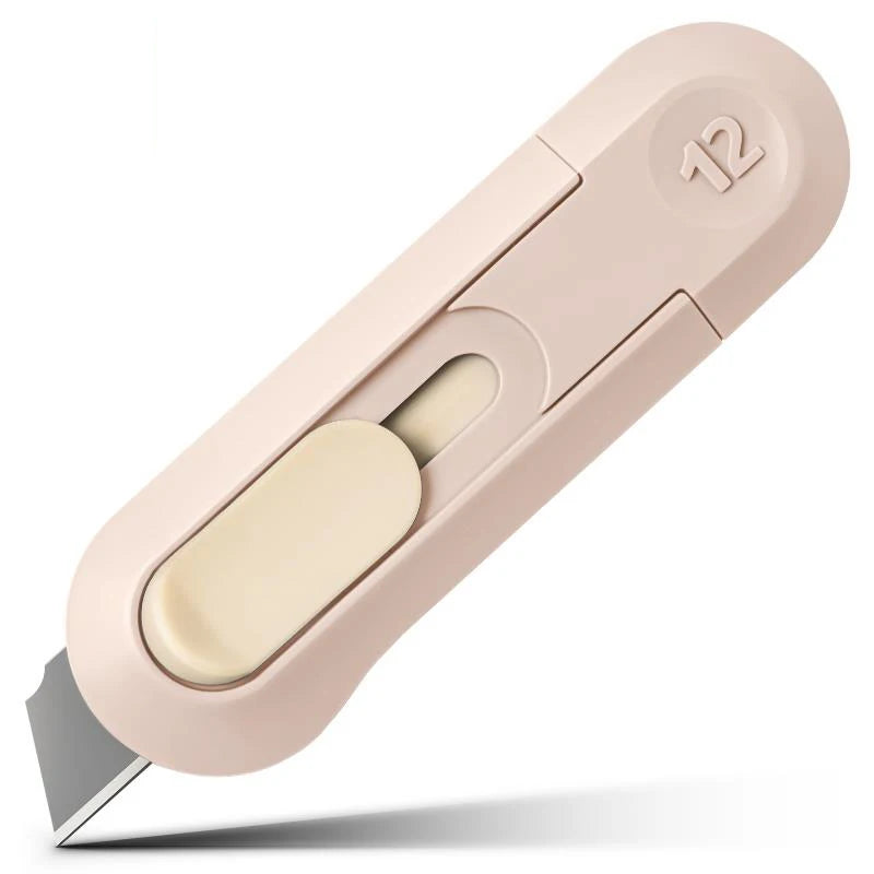 Rosa Präzisions-Mini-Papiercutter mit Klinge und nummerierter Führung.