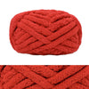 A ball of chunky red chenille yarn used for hand knitting and crochet