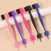 A collection of various colored edge control brushes for hairlines and wigs displayed on a light background.