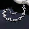 Pulsera de Cadena Corazón y Flor en Plata de Ley