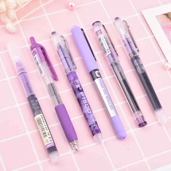 A set of six purple smooth gel pens for school and office use displayed on a pink grid background.