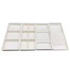 White plastic drawer organizer tray with multiple compartments for dental instruments