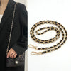 Gold and black chain strap for bags and phone cases shown next to a black blazer.