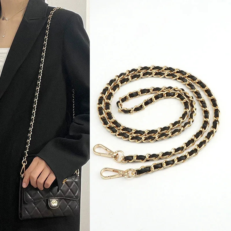 Gold and black chain strap for bags and phone cases shown next to a black blazer.