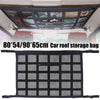 Black mesh car roof storage bag with multiple compartments for overhead cargo organization