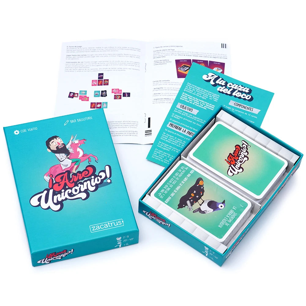 A box set of the Irre Unicornios card game featuring colorful cards and rule sheets.