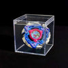A Valkyrie Volt S4-70V metal spinning top with launcher displayed inside a clear plastic box.