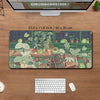 A large extended desk mat featuring a kawaii nature design of various green frogs and plants.