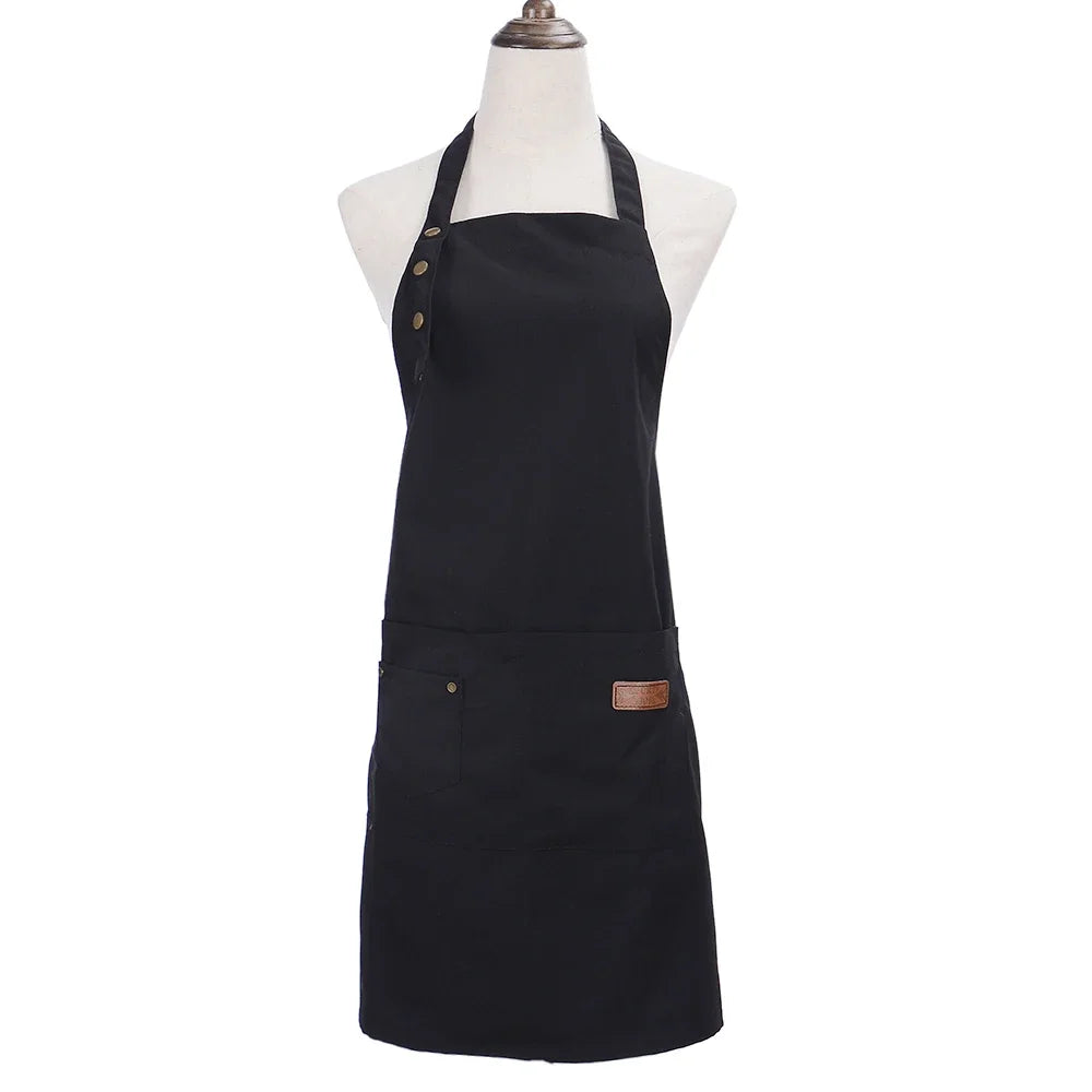 Black durable canvas kitchen apron displayed on a mannequin.