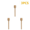 Three natural wood honey dipper sticks shown vertically.