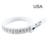 A white adjustable ring and bracelet sizer measuring tool with a numbered scale.