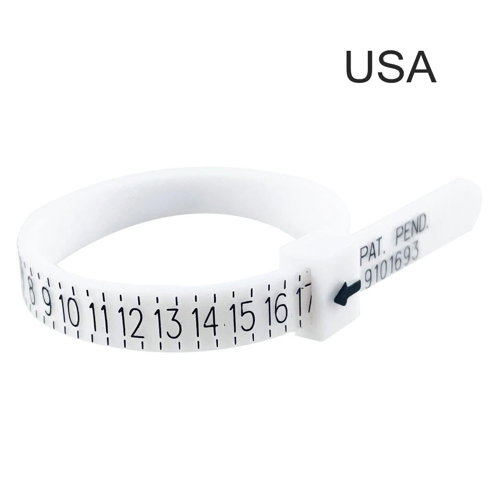 A white adjustable ring and bracelet sizer measuring tool with a numbered scale.