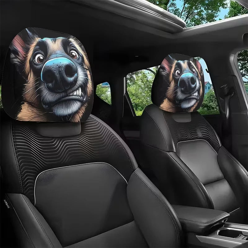 A pair of slanted eyes dog headrest covers placed on a black car seat interior.