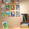 A display of twelve framed mini diamond art pieces featuring various landscapes and scenes.