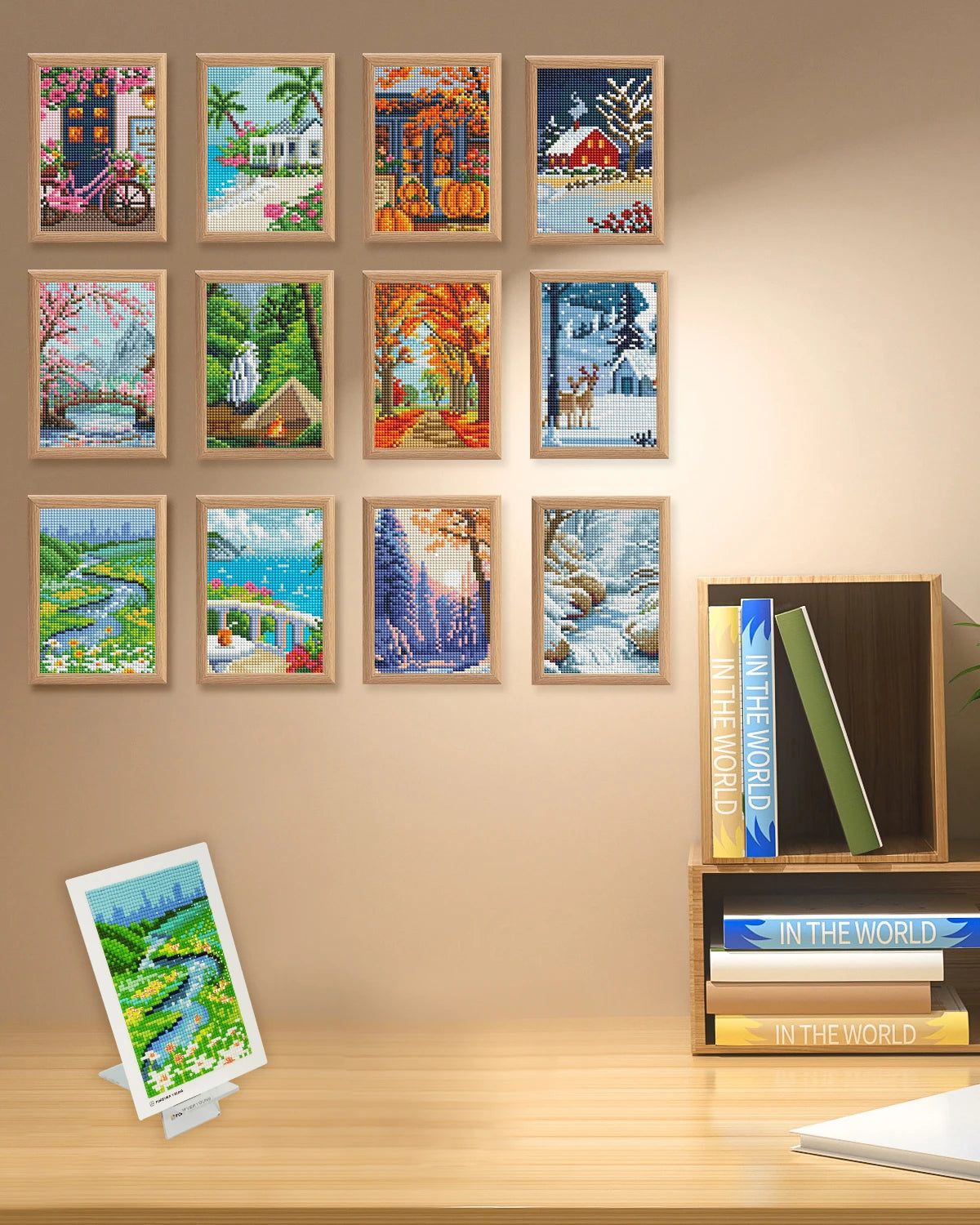 A display of twelve framed mini diamond art pieces featuring various landscapes and scenes.
