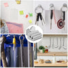 A collection of versatile magnetic stickers and tools displayed on a white wall and wooden counter.