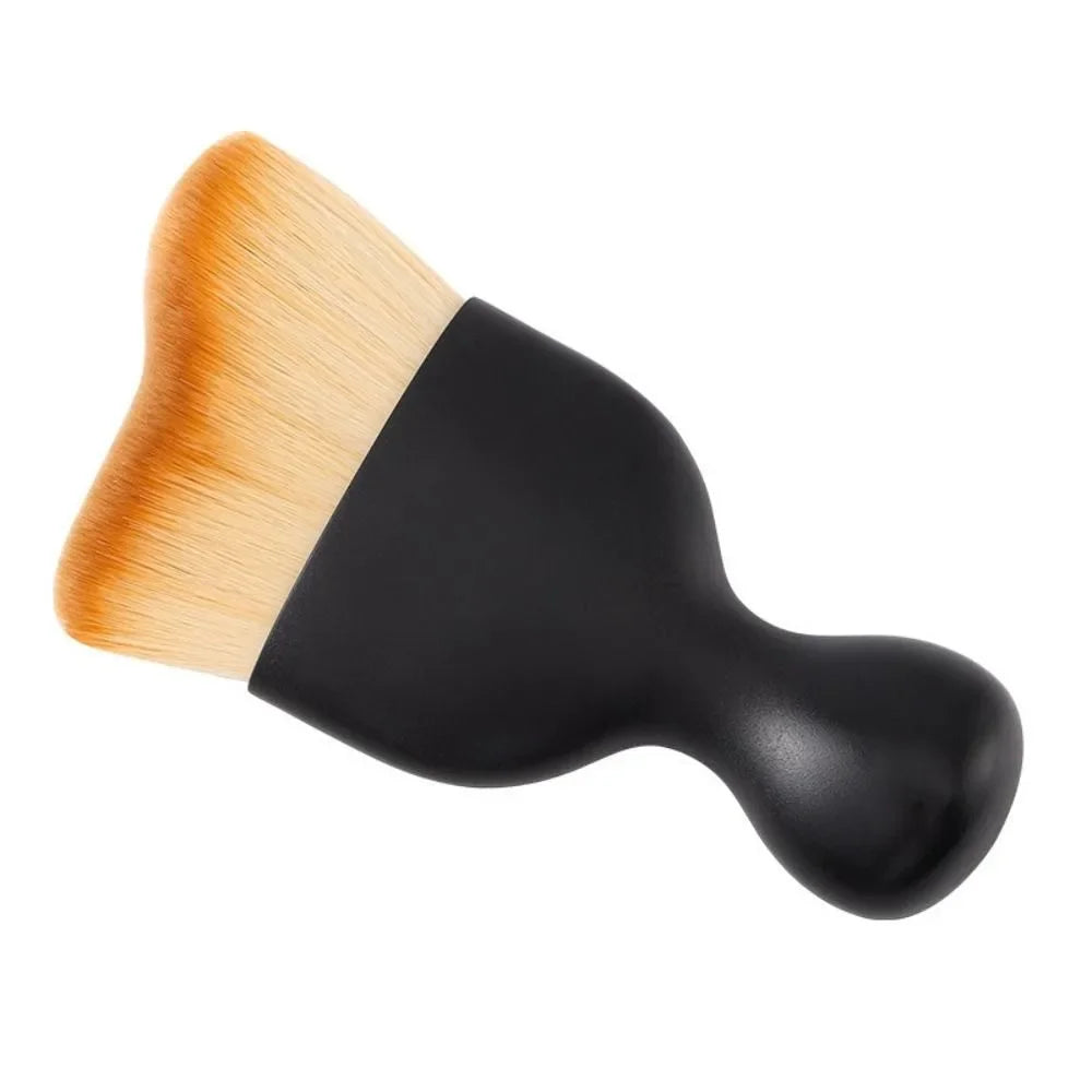A black and natural fiber detailing brush with a curved head for cleaning car vents and gaps.