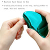 A hand holds a vibrant teal polish nail surface, demonstrating the product's shine.