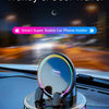 A circular car phone holder with an RGB ambient light is mounted on a car dashboard.