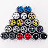 A collection of ten pairs of 1:64 scale alloy car wheels and tires in various colors including blue, gold, silver, and black.