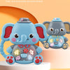 A cute blue elephant toy with colorful decorations and parts sent randomly, sitting on a light orange surface.