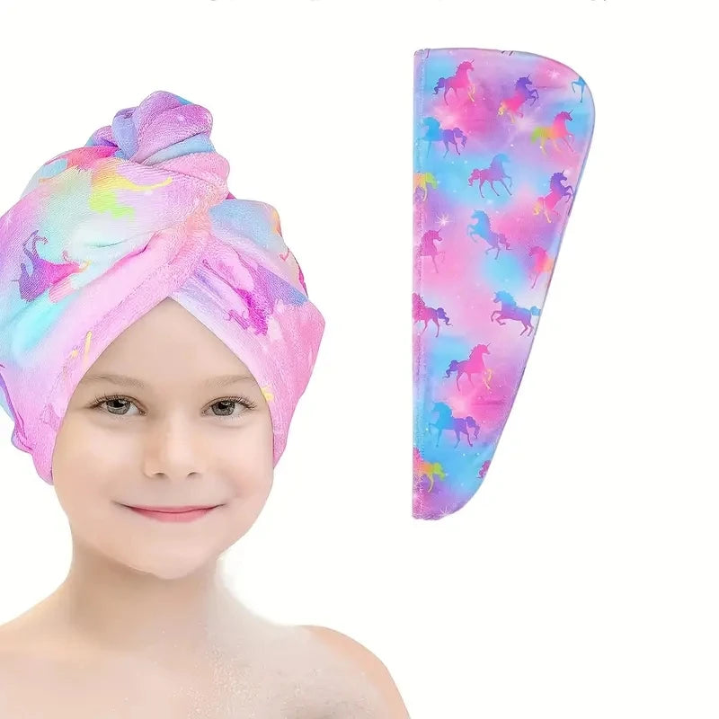A pink microfiber hair drying towel wrap featuring a vibrant unicorn pattern with purple and pink hues.