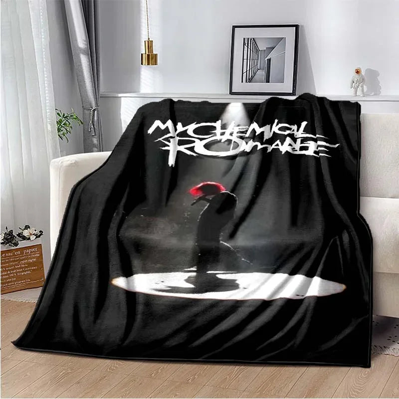 A black fleece throw blanket featuring a graphic of the My Chemical Romance band logo and silhouette.