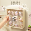 A wall-mounted dustproof display case for collectible dolls featuring various baby and child figures.