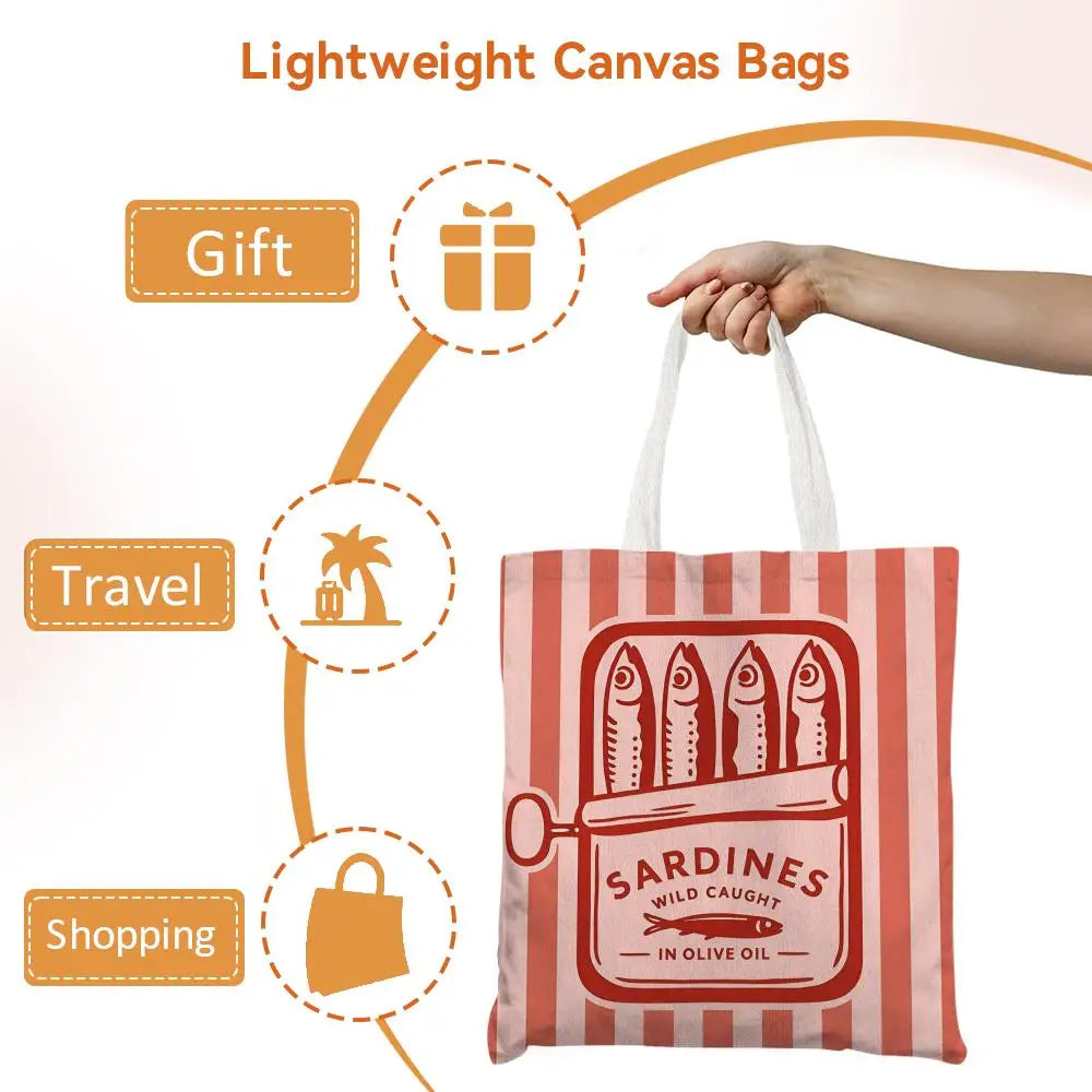 A red and white striped canvas tote bag featuring a graphic print of sardines in olive oil.