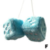 A turquoise plush velvet dice car mirror pendant hanging from a string.