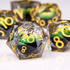 A close-up of a set of liquid core resin dice featuring a dragon eye design, showing various numbers and colors.