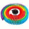 A circular arrangement of 120 multicolor wooden domino building blocks in various colors radiating from the center.