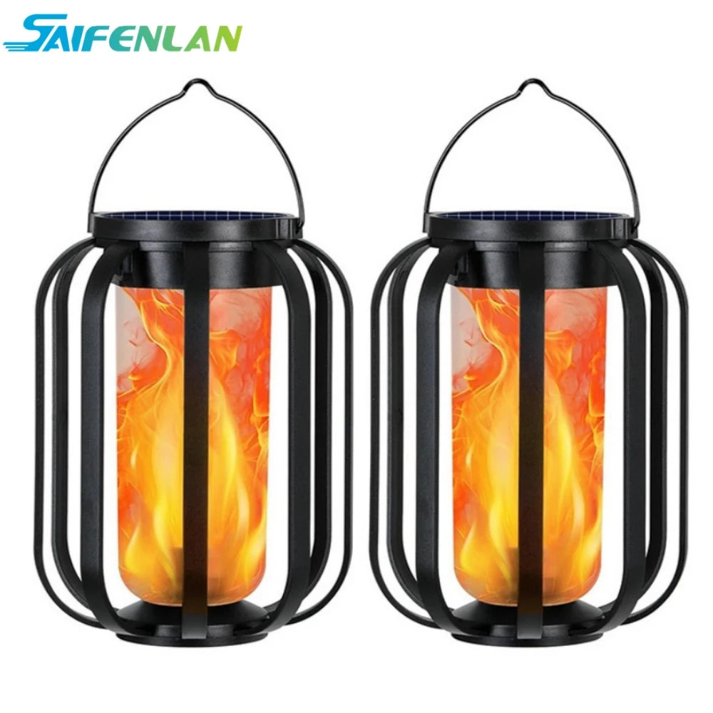 A pair of black solar flickering flame lanterns with glass inserts, designed for outdoor hanging light.