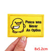 Yellow embroidered patch featuring a cartoon chick with the text Peace was Never An Option