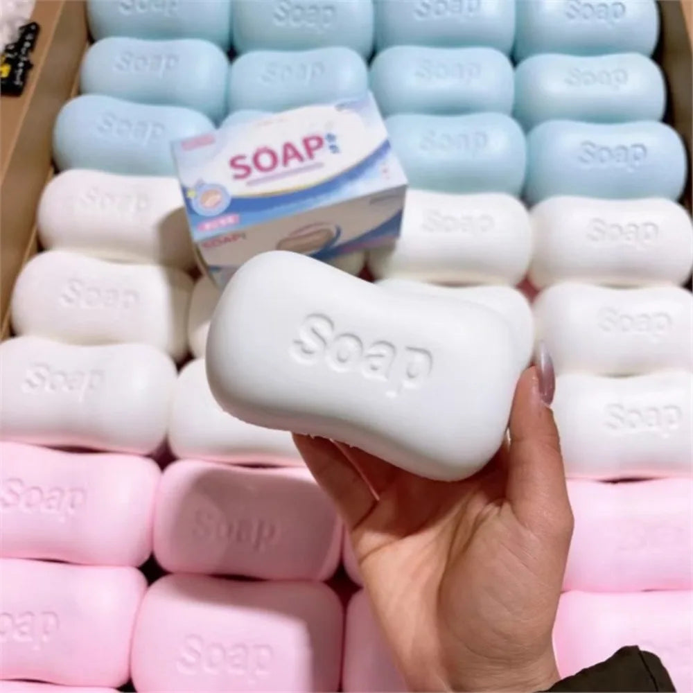 A hand holds a white stress relief squishy soap shape fidget toy in various colors and packaging.