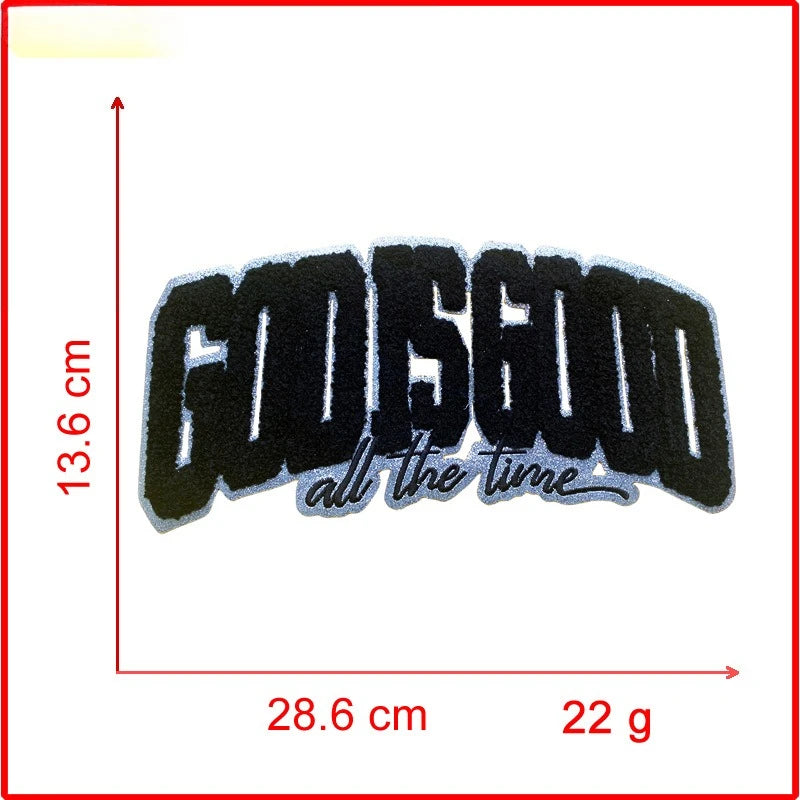 Black embroidered patch with the text GOD IS GOOD all the time on a white background.