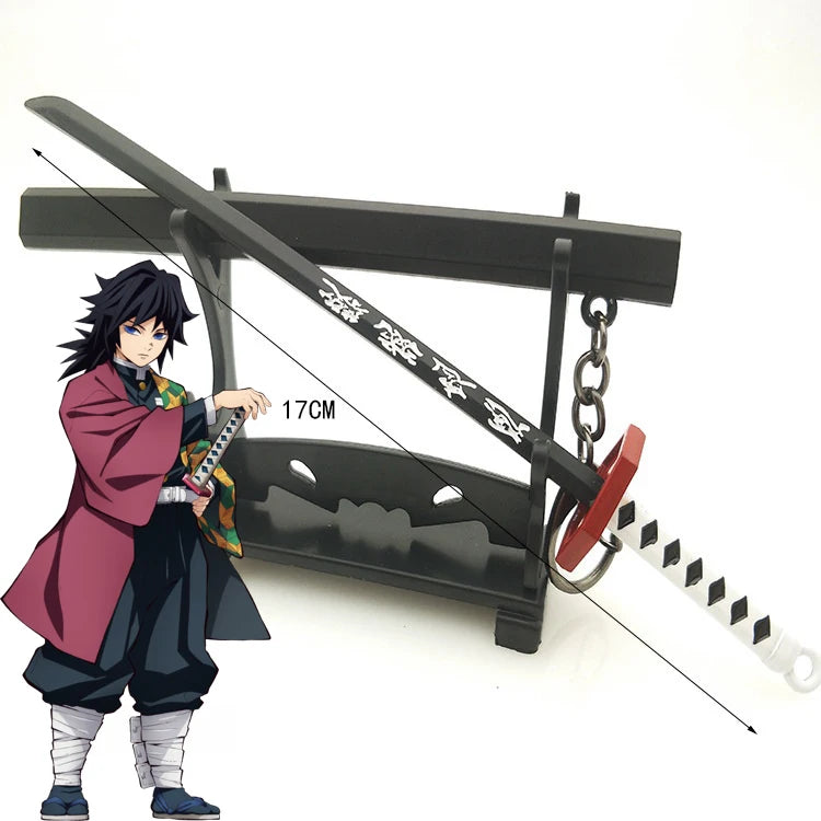 A miniature replica of a Demon Slayer katana sword with a dark metal hilt and a figure inspired by Tanjiro.