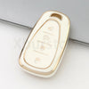 A white and gold durable TPU key fob cover for a Chevrolet vehicle.