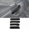 Black carbon fiber grain trim cover for Ford F-150 center console.