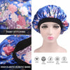 A satin hair bonnet in blue floral print with a black elastic band shown next to a mannequin head.