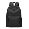 A black minimalist unisex canvas backpack with multiple compartments and a zippered top.
