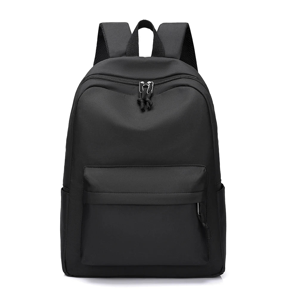 A black minimalist unisex canvas backpack with multiple compartments and a zippered top.