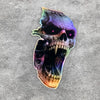 A detailed vinyl decal of a skull with glowing purple and green accents on a gray background.