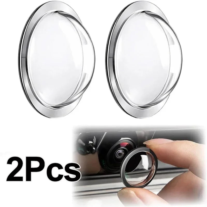 Two clear plastic lens protectors for a universal car camera, shown against a car window.