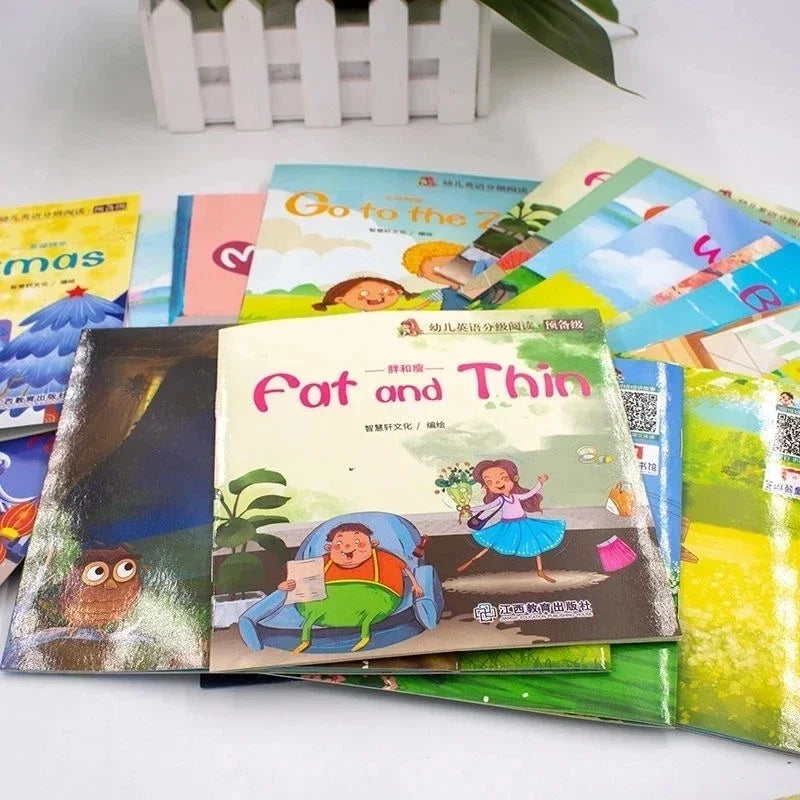 A stack of colorful picture books for early English learning and bedtime stories are displayed on a white surface.
