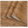 Rolls of self-adhesive wood grain waterproof wallpaper showing the texture and finish.