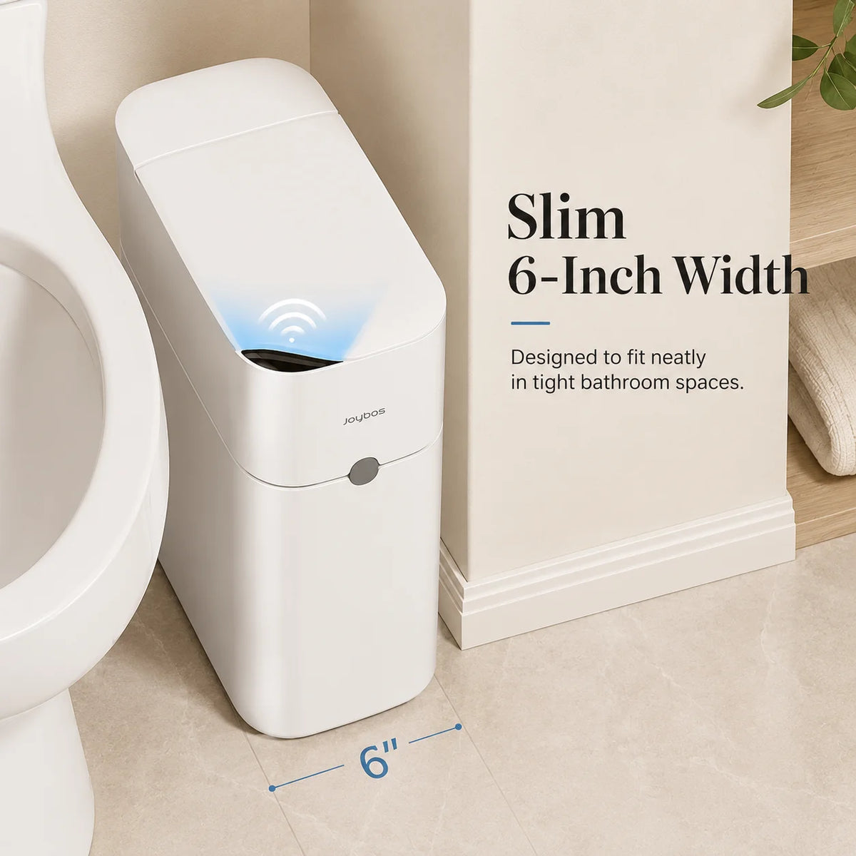 A white slim trash can with a motion sensor is shown next to a toilet, highlighting its 6-inch width.