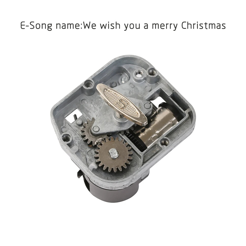 A vintage hand-cranked wooden music box mechanism with gears and a metal casing.